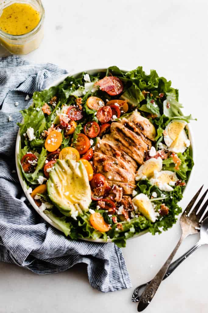 Bright salad with grilled chicken, avocado, tomatoes
