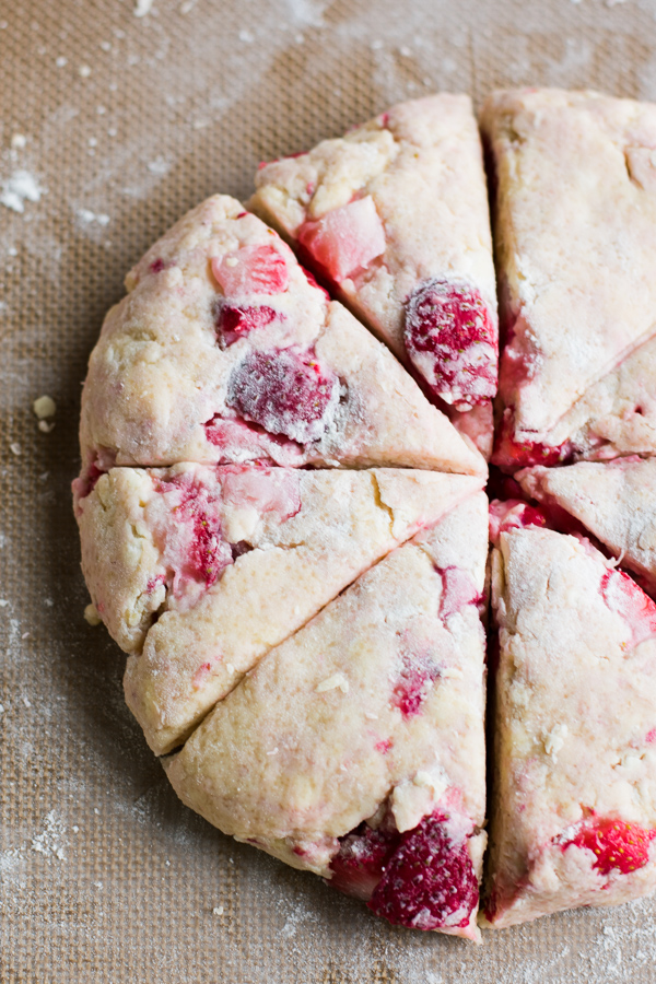 Strawberry Scones - A quick and delicious recipe that's buttery, flaky, sweet, and oh so delicious! Perfect for brunch, snacking, or enjoying all summer long! #strawberry #scones #strawberryscones #brunchrecipes #breakfastrecipes #sconerecipe #summerrecipes #baking #bluebowlrecipes | bluebowlrecipes.com