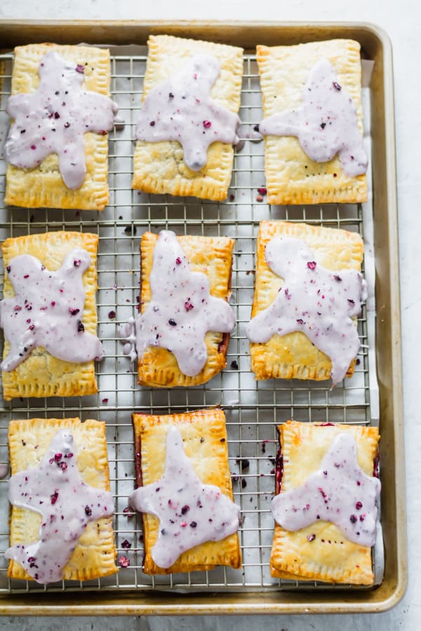 Blueberry poptarts on a cooling rack.