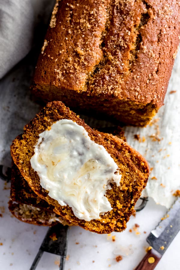 A pumpkin bread slice with butter.