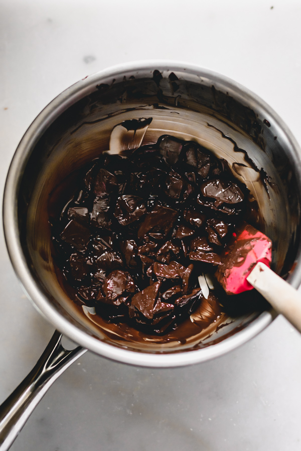 Chocolate chunks melting in a pot.