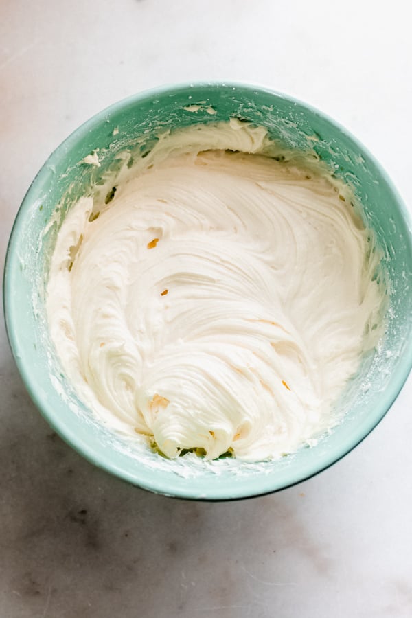 Mascarpone cream cheese frosting in a bowl.