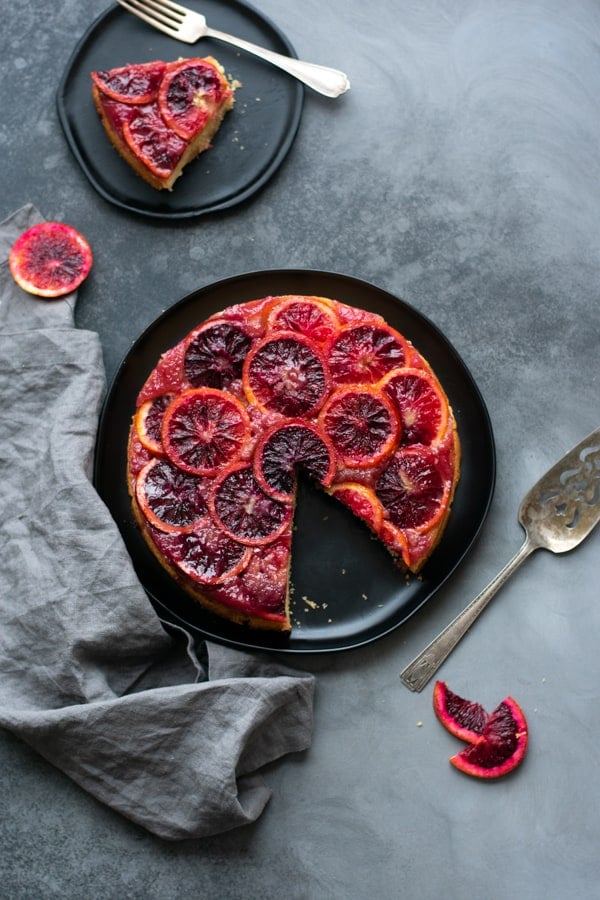 Blood orange upside down cake on a plate.