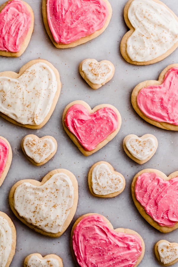 Pink and white frosted heart cookies.