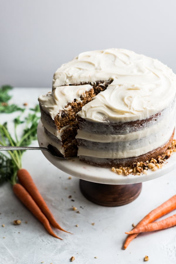 Carrot cake on a cake stand.