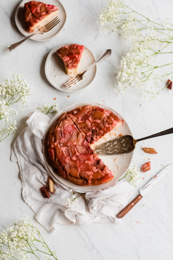 Rhubarb Upside Down Cake - Hello love! This is the essence of summer all wrapped up into one beautiful package. We've got everything - a luscious layer of juicy rhubarb on top, a thick layer of cake in the middle, and a surprise crumb layer on bottom. Simply divine! Better make two, because this cake will be eaten FAST. #rhubarb #cake #upsidedowncake #memorialdayrecipes #summer #dessert #summerdessert #fourthofjulyrecipes #summerrecipes #picnicrecipes #bluebowlrecipes | bluebowlrecipes.com
