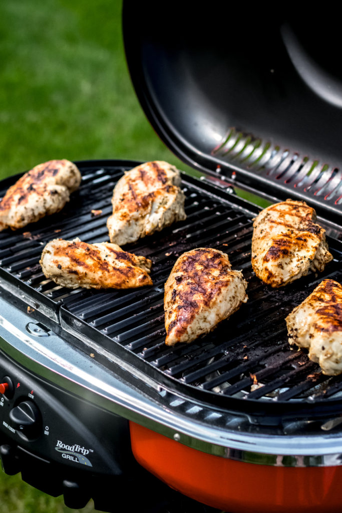 Chicken breasts on a grill.