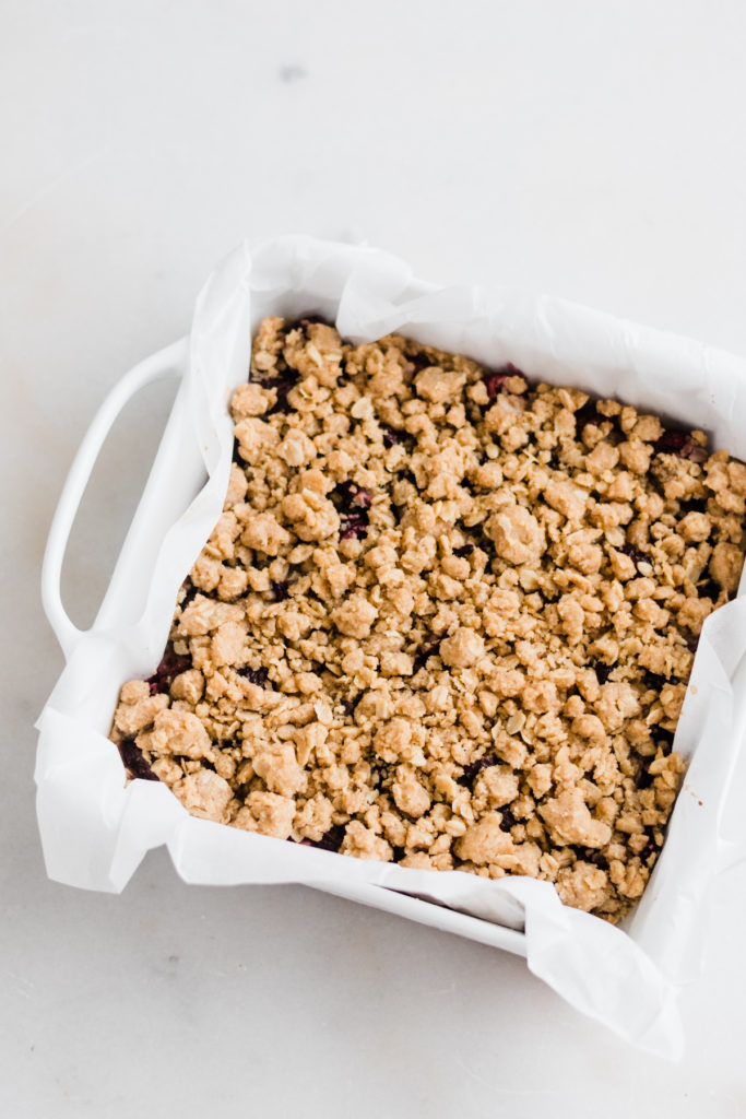 Cherry pie crumble bars in a pan.