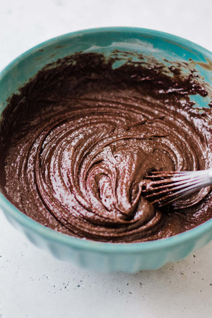 Brownie batter mixing in a bowl.