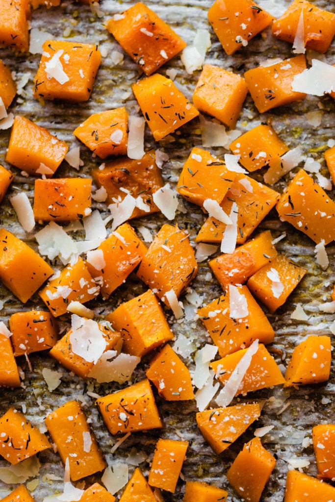 How to Make Easy Roasted Butternut Squash - Roasted Butternut Squash is a quick and easy side to add to any meal! It's tender, caramelized on the edges from the oven-roasting method, and flavored with sage and thyme. All you need to make this golden fall goodness is 40 minutes, a butternut squash, and a handful of pantry staples. #easyrecipe #vegetarianrecipes #dinnerrecipes #sidedishrecipes #butternutsquashrecipes #glutenfreerecipes #veganrecipes #bluebowlrecipes | bluebowlrecipes.com