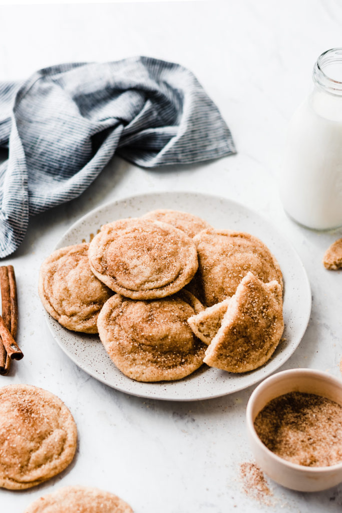 Snickerdoodle cookies piled on a plate.