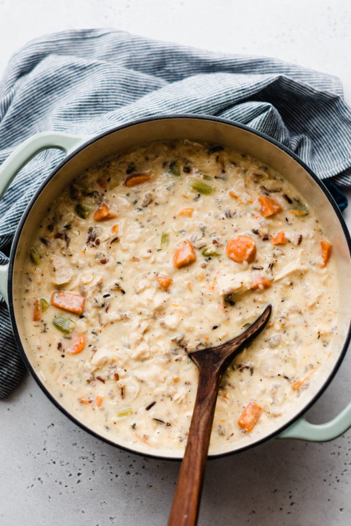 Chicken Wild Rice Soup - Chicken Wild Rice Soup is the ultimate comfort food! It's rich and creamy, full of tender veggies, herbed chicken, and hearty wild rice. Don't forget the crusty bread for dunking! #chickenwildricesoup #soup #fallrecipes #winterrecipes #souprecipes #chickenrecipes #chickenrecipeseasy #comfortfood #easyrecipe #dinnerrecipes #chickensoup #halloweenfood #holidayrecipes #bluebolwrecipes | bluebowlrecipes.com