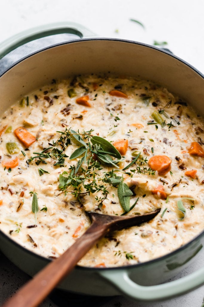 Chicken Wild Rice Soup - Chicken Wild Rice Soup is the ultimate comfort food! It's rich and creamy, full of tender veggies, herbed chicken, and hearty wild rice. Don't forget the crusty bread for dunking! #chickenwildricesoup #soup #fallrecipes #winterrecipes #souprecipes #chickenrecipes #chickenrecipeseasy #comfortfood #easyrecipe #dinnerrecipes #chickensoup #halloweenfood #holidayrecipes #bluebolwrecipes | bluebowlrecipes.com