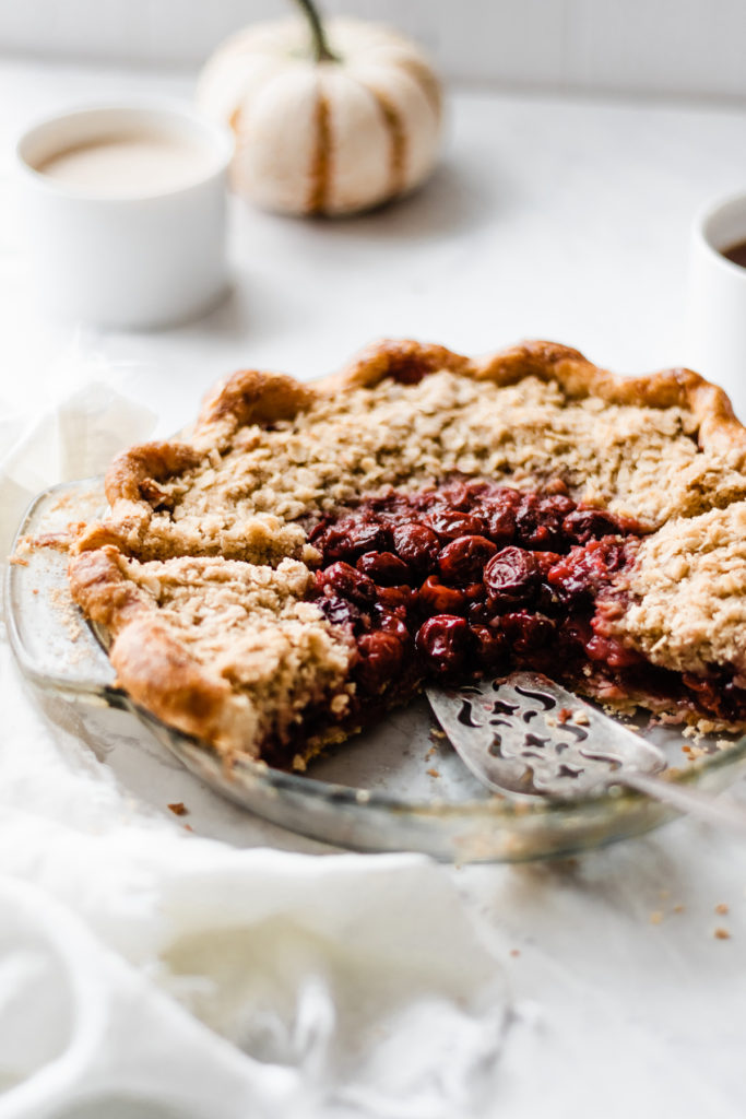 Bourbon Cherry Pie with Crumble Topping - Bourbon Cherry Pie is here and it is filled with a delicious, sweet (but not too sweet), easy homemade cherry filling that's spiked with a bit of bourbon. The crumble topping is super simple - and it shows off the beautiful cherry filling! Serve with a heap of vanilla ice cream. This pie is INSANELY delicious! #pierecipes #cherrypie #bourbon #thanksgivingrecipes #thanksgivingfood #dessertrecipes #holidayrecipes #bluebowlrecipes | bluebowlrecipes.com