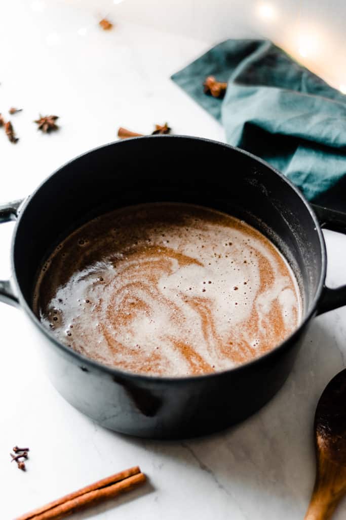 Homemade Hot Buttered Rum - Hot Buttered Rum is incredibly easy to whip up, and it's warm, comforting, and cozy! Made with rum, hot water, butter, brown sugar, maple syrup, cinnamon, and nutmeg. Perfect for festive holidays and cold winter nights. #hotbutteredrum #newyearsrecipes #newyearseve #drinkrecipes #christmasrecipes #christmasdrinks #easyrecipes #glutenfreerecipes #bluebowlrecipes | bluebowlrecipes.com