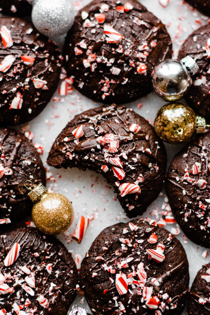 Peppermint mocha cookies drizzled with chocolate and sprinkled with crushed peppermint candies.