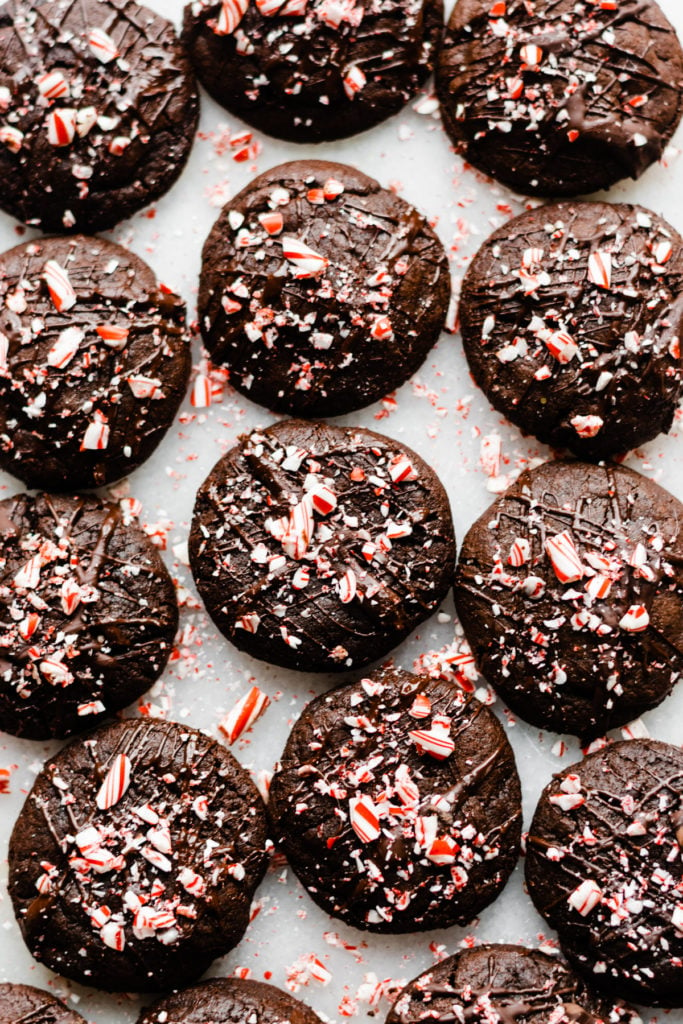 Peppermint mocha cookies lined up on a marble surface.