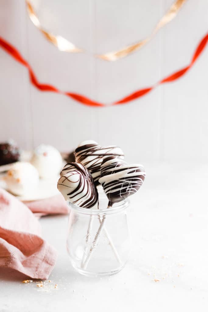 Homemade Chocolate Cake Pops - These rich chocolate cake pops are perfectly fudgy and moist, and are surprisingly easy to make at home! Made with a mix of rich, fudgy chocolate cake, sweetened condensed milk, and silky chocolate frosting - roll this mixture into balls, dip into chocolate, and dig in! #cakepops #chocolate #chocolaterecipes #dessertrecipes #valentinesday #superbowl #superbowlfood #birthdayrecipes #birthdaycake #bluebowlrecipes | bluebowlrecipes.com