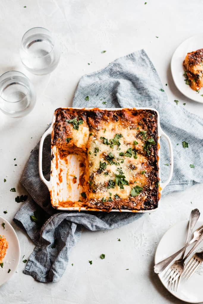 Mom's Easy Homemade Lasagna - This is the best homemade lasagna! Made with layers of an easy homemade meat sauce, a mix of mozzarella, ricotta, and parmesan cheese, and TONS of flavor! This recipe can be scaled up or down to feed whatever size crowd you have and it's always a hit! #lasagna #lasagnarecipe #dinner #holidayfood #holidayrecipes #valentinesdinner #holidaydinner #easyrecipes #dinnerrecipes #familydinner #comfortfood #cheeserecipes #bluebowlrecipes | bluebowlrecipes.com