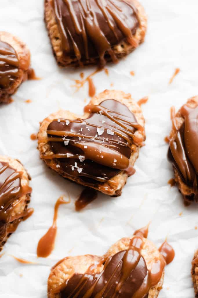 Heart shaped nutella pop tarts with nutella glaze and salted caramel drizzle.