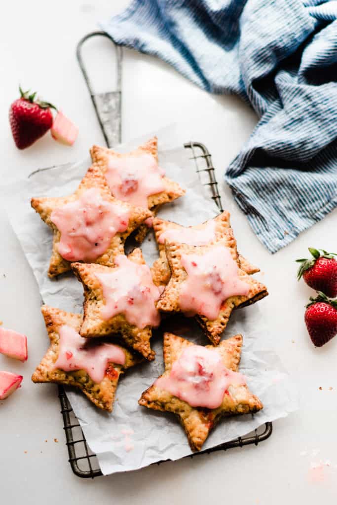 Star shaped hand pies on grate with strawberries