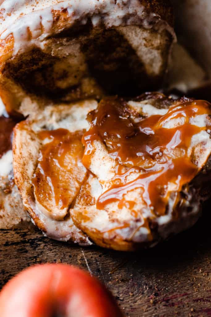 A very close up shot of two pieces of the bread, drizzled with salted caramel sauce