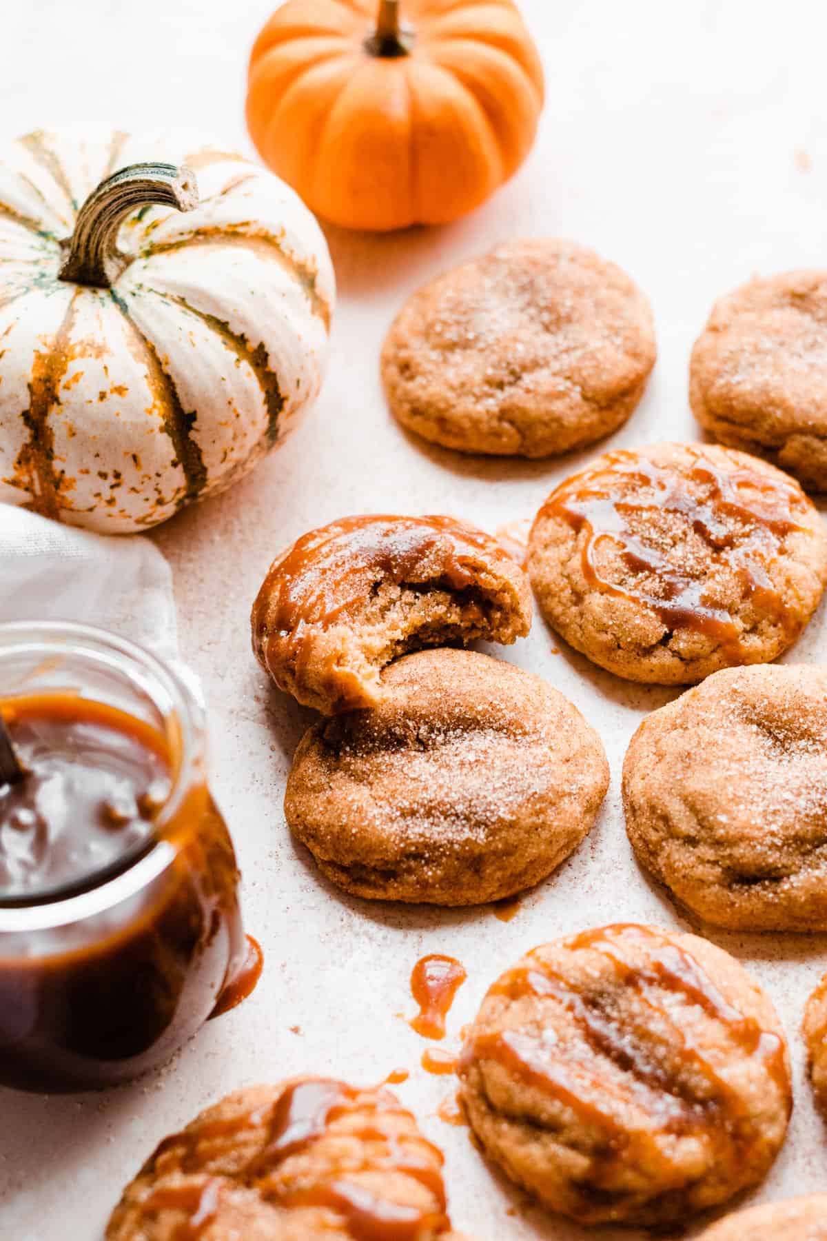 Pumpkin snickerdoodle cookies drizzled with salted caramel sauce.