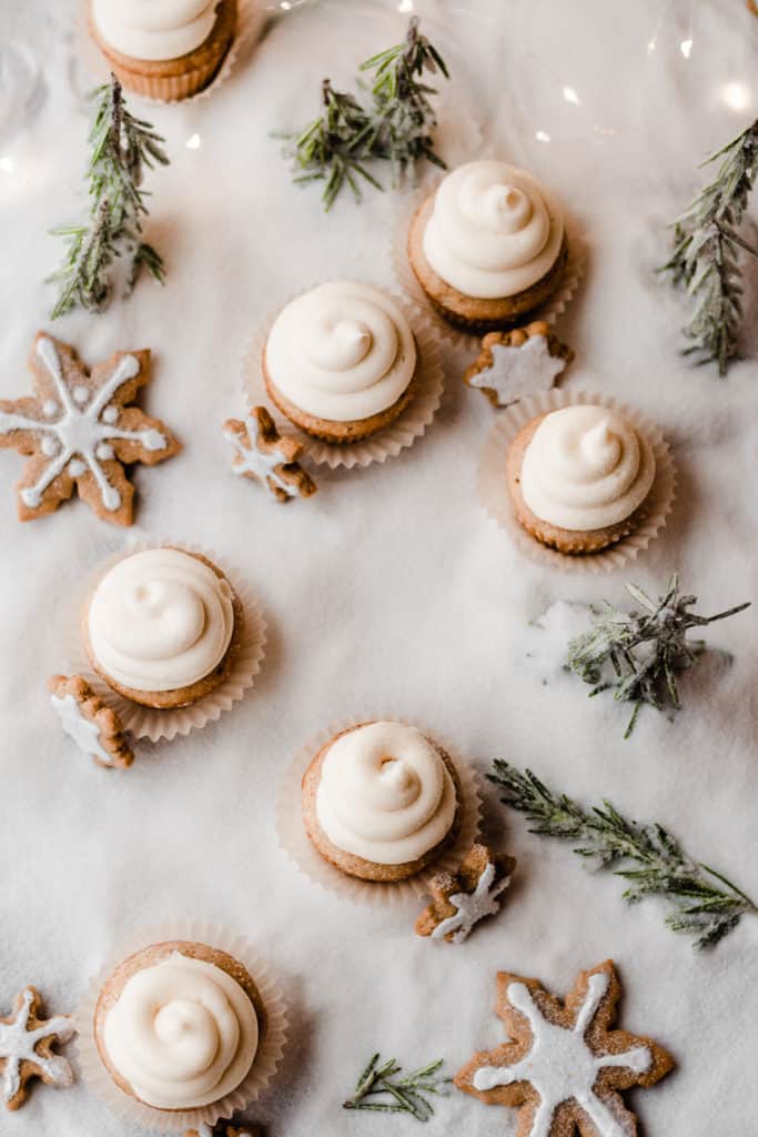 A top down view of the cupcakes in a sugar snow forest of rosemary trees