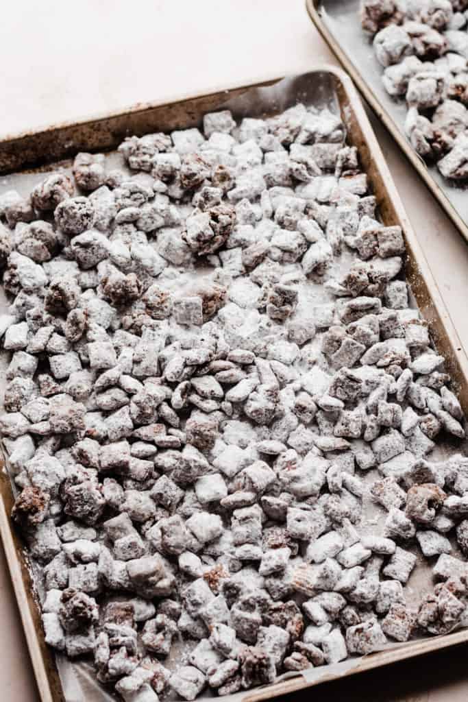 Two sheet pans filled with puppy chow
