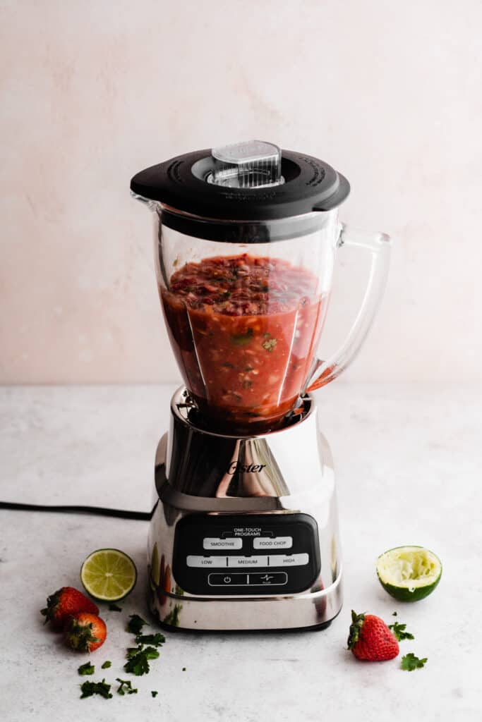 A blender with the blended salsa inside