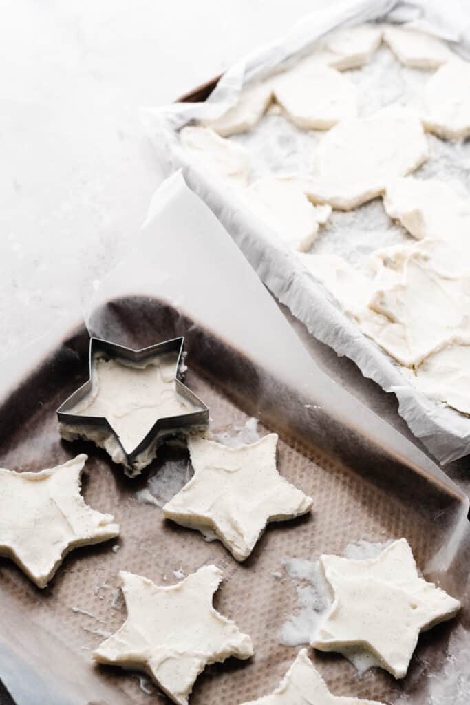 Star shaped ice cream pieces being cut out of the pan of ice cream.