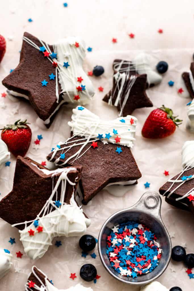Star-shaped ice cream sandwiches decorated with white chocolate and red, white, and blue sprinkles.