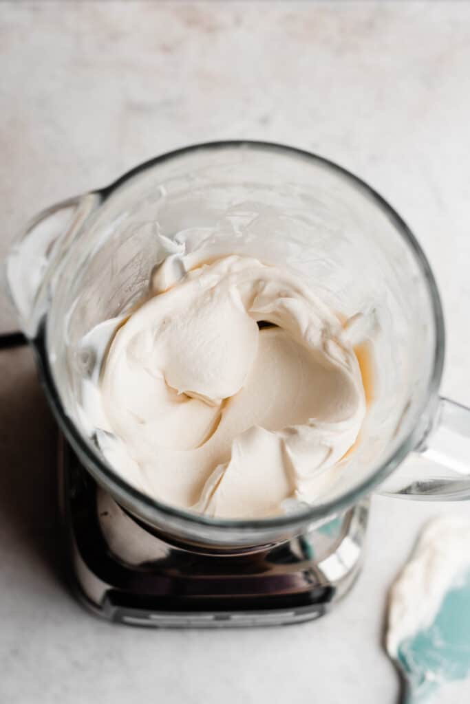 A birds-eye view inside the blender, with the creamy whipped cream.