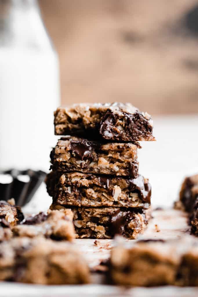 A stack of the cookie bars, with a bite taken out of the top piece.