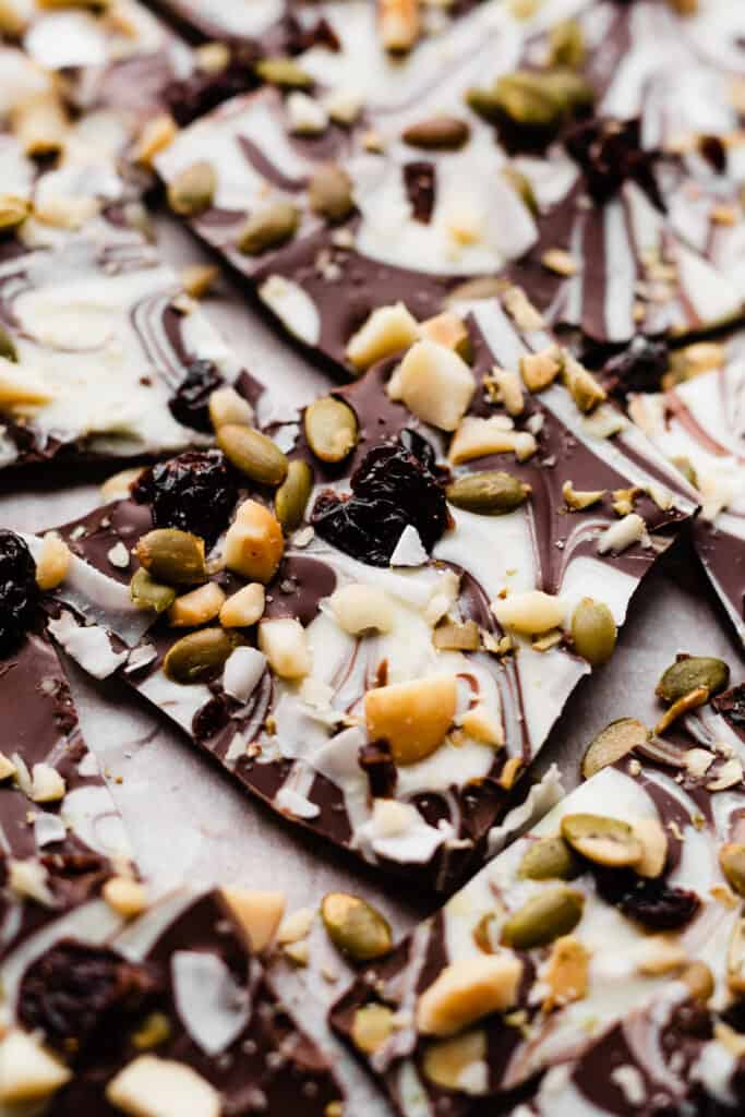 Pieces of chocolate bark on parchment paper. 