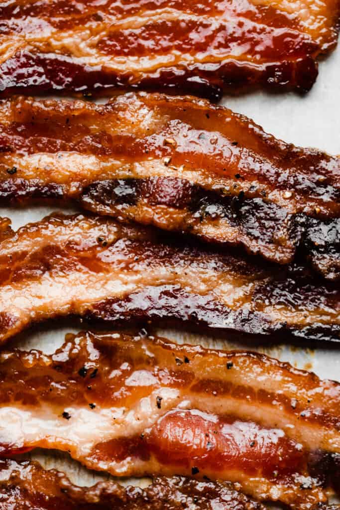 A close-up of slices of candied bacon.