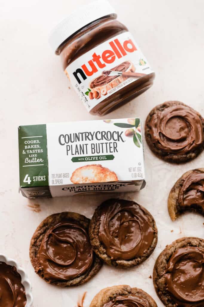 A close-up on the cookies along with a package of plant-based butter and Nutella.