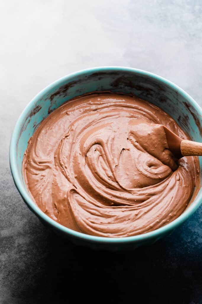 Luscious chocolate cheesecake batter in a mixing bowl.