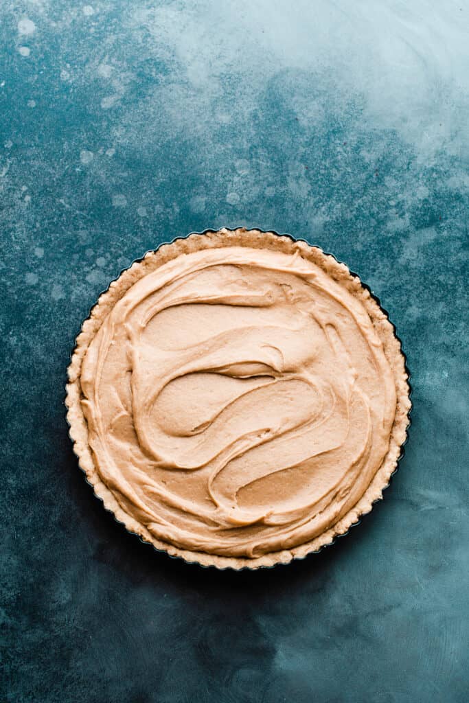 The tart crust filled with the creamy peanut butter filling.