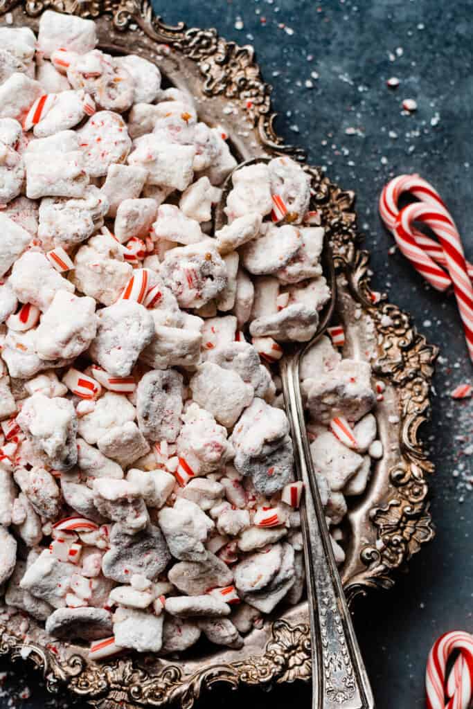 A close-up of a vintage tray of white chocolate peppermint puppy chow.
