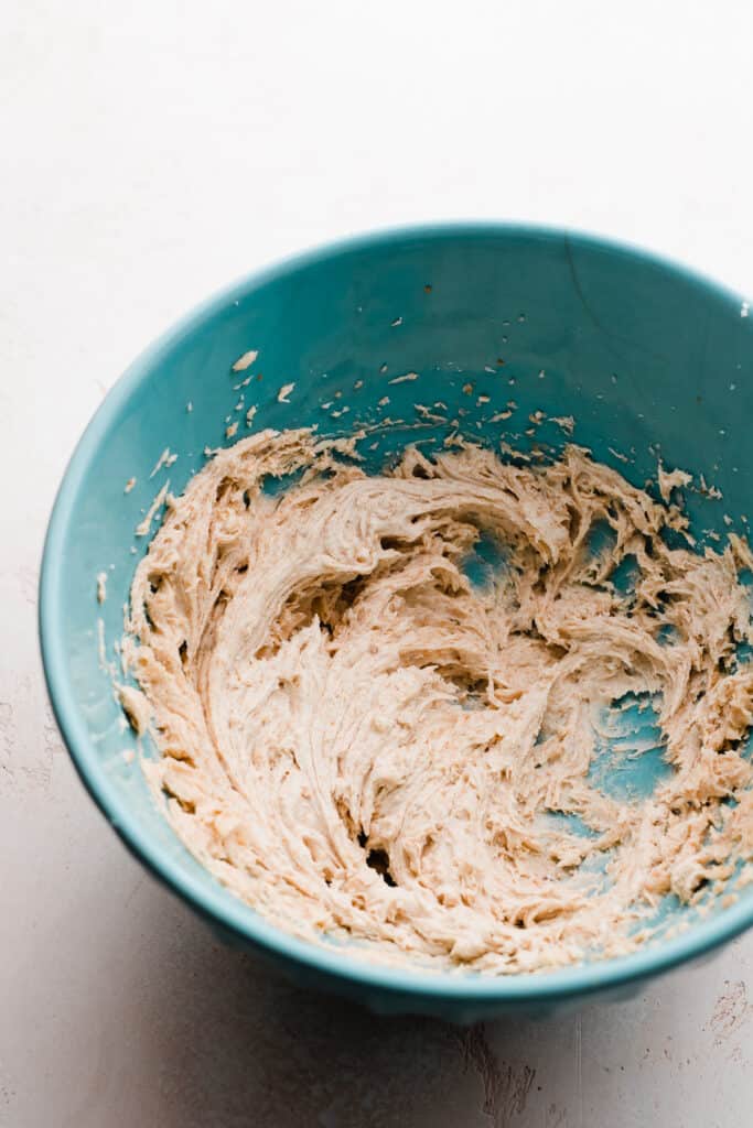 A mixing bowl with the creamed brown butter.