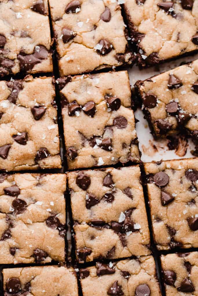 A close-up of the chocolate chip cookie bars topped with flaky sea salt.