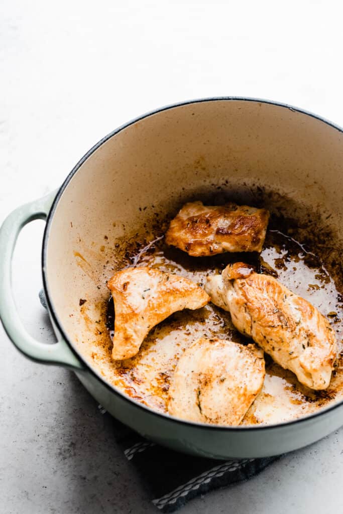 A pot of golden brown cooked chicken. 