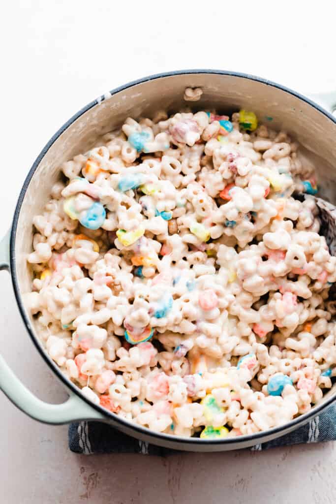A dutch oven filled with the rice krispie mixture.