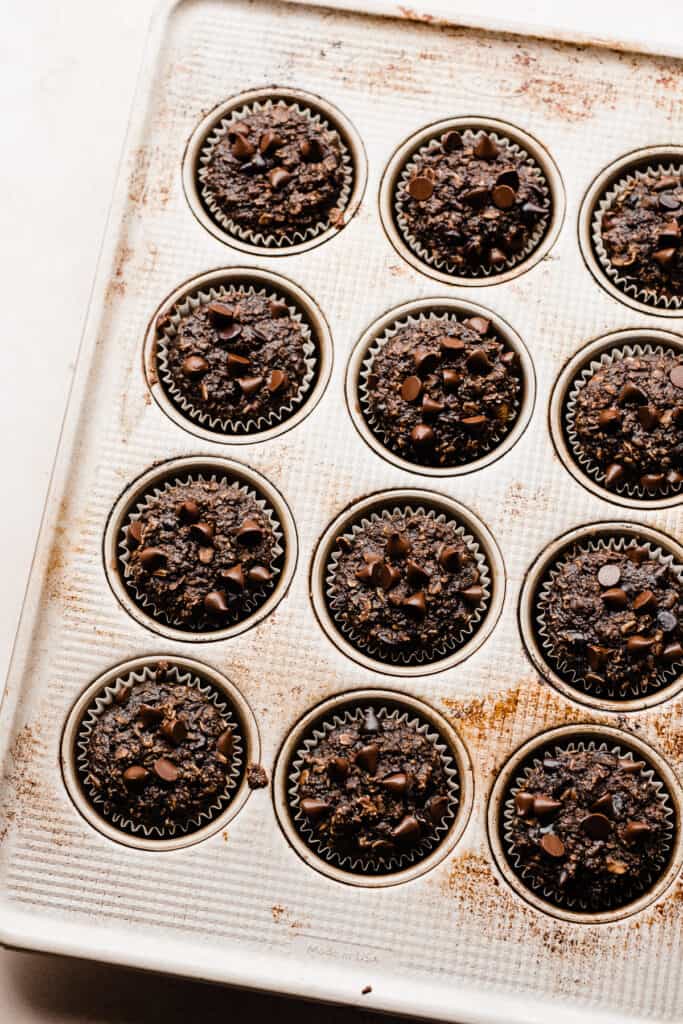 A muffin pan of the baked chocolate muffins.