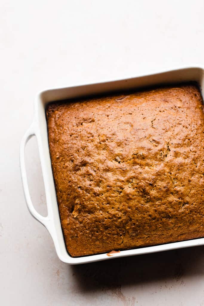 The baked cake in a 9-inch square pan.