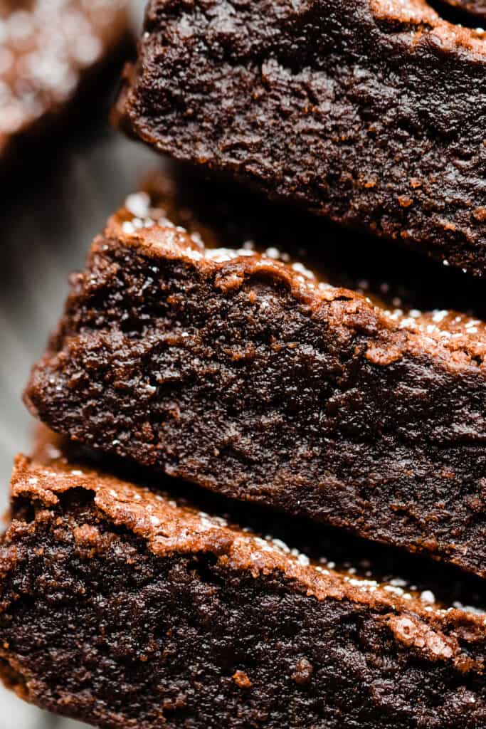 A close-up on a stack of the fudgy brownies. 