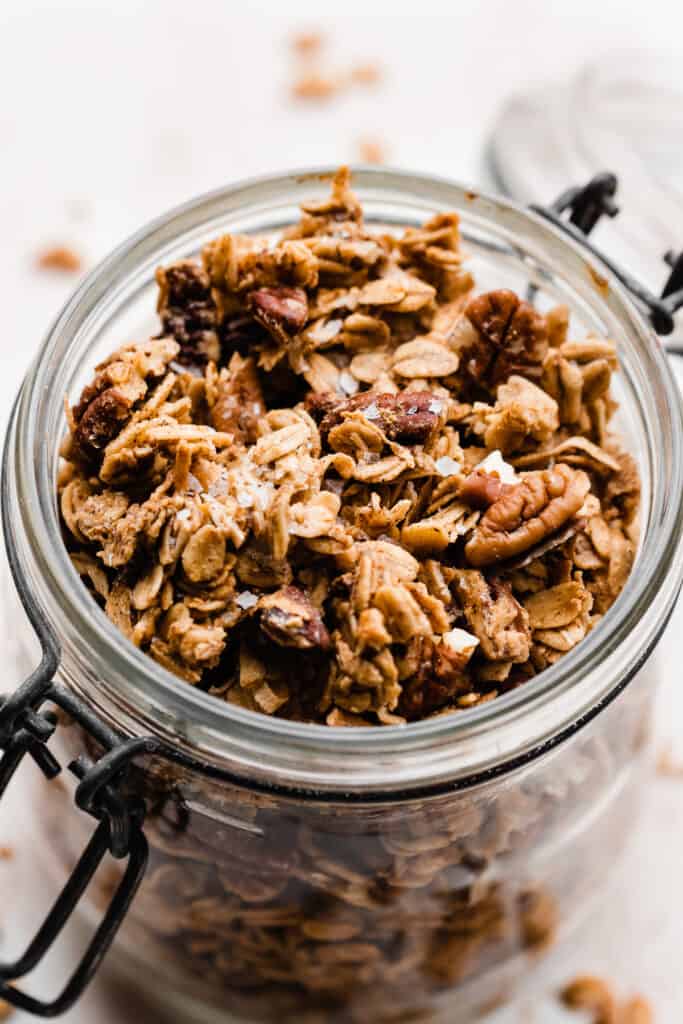 A close-up on the top of a jar full of the granola.