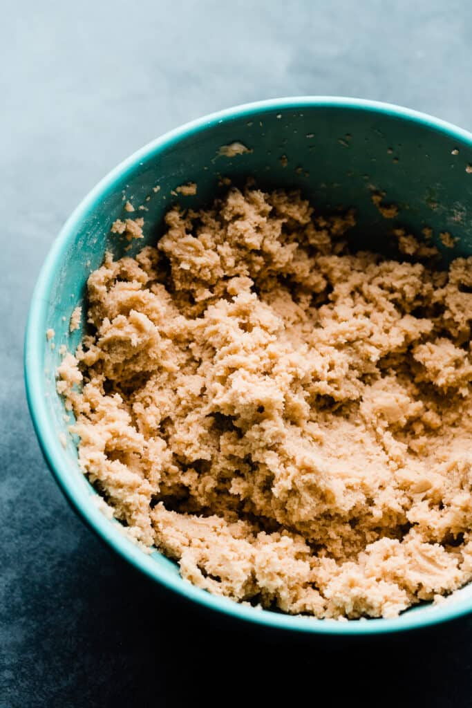 A mixing bowl full of cookie dough.