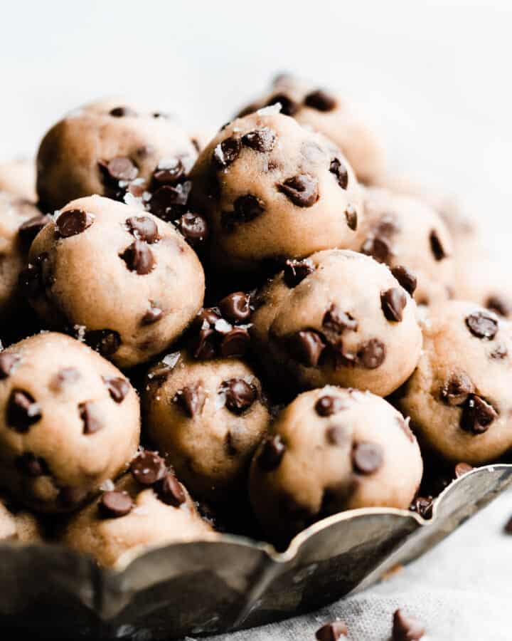No bake cookie dough bites piled in a metal tray.